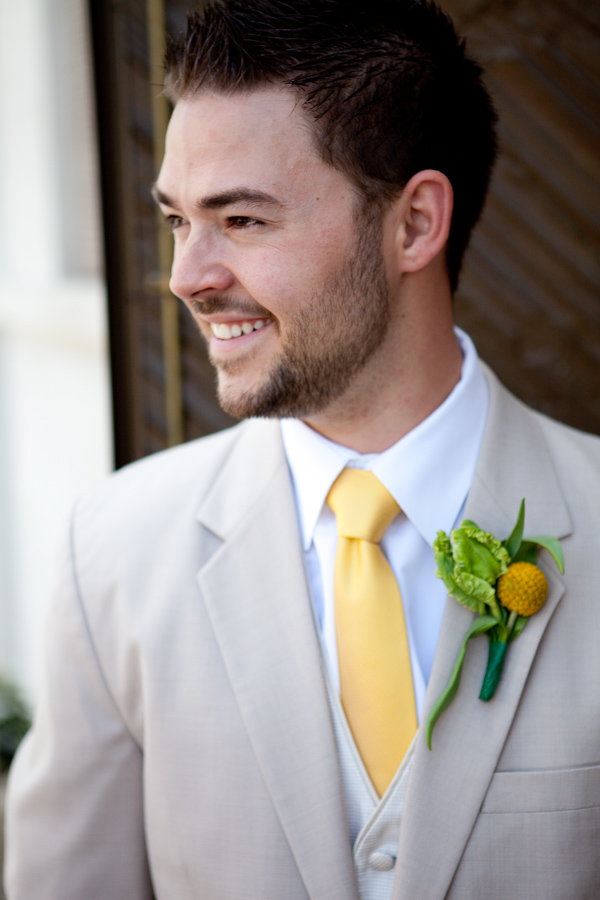 gray suit with yellow tie